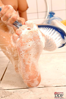Mandy Dee washing her dirty feet