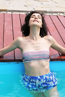 Callista B - Hot brunette swims half-naked in the outdoor pool