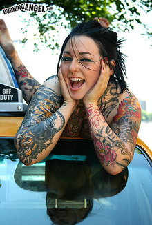 Tattooed slut Adahlia posing outdoor