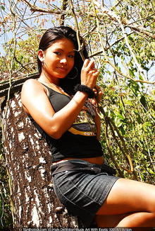 Busty asian model outdoor strips