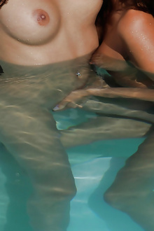Hot lesbians pussy fingers in the pool