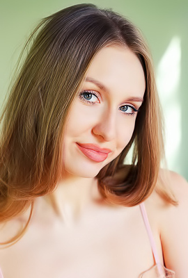 Lia Pink Kneels To Offer An Enticing Rear View Of Her Voluptuous Booty